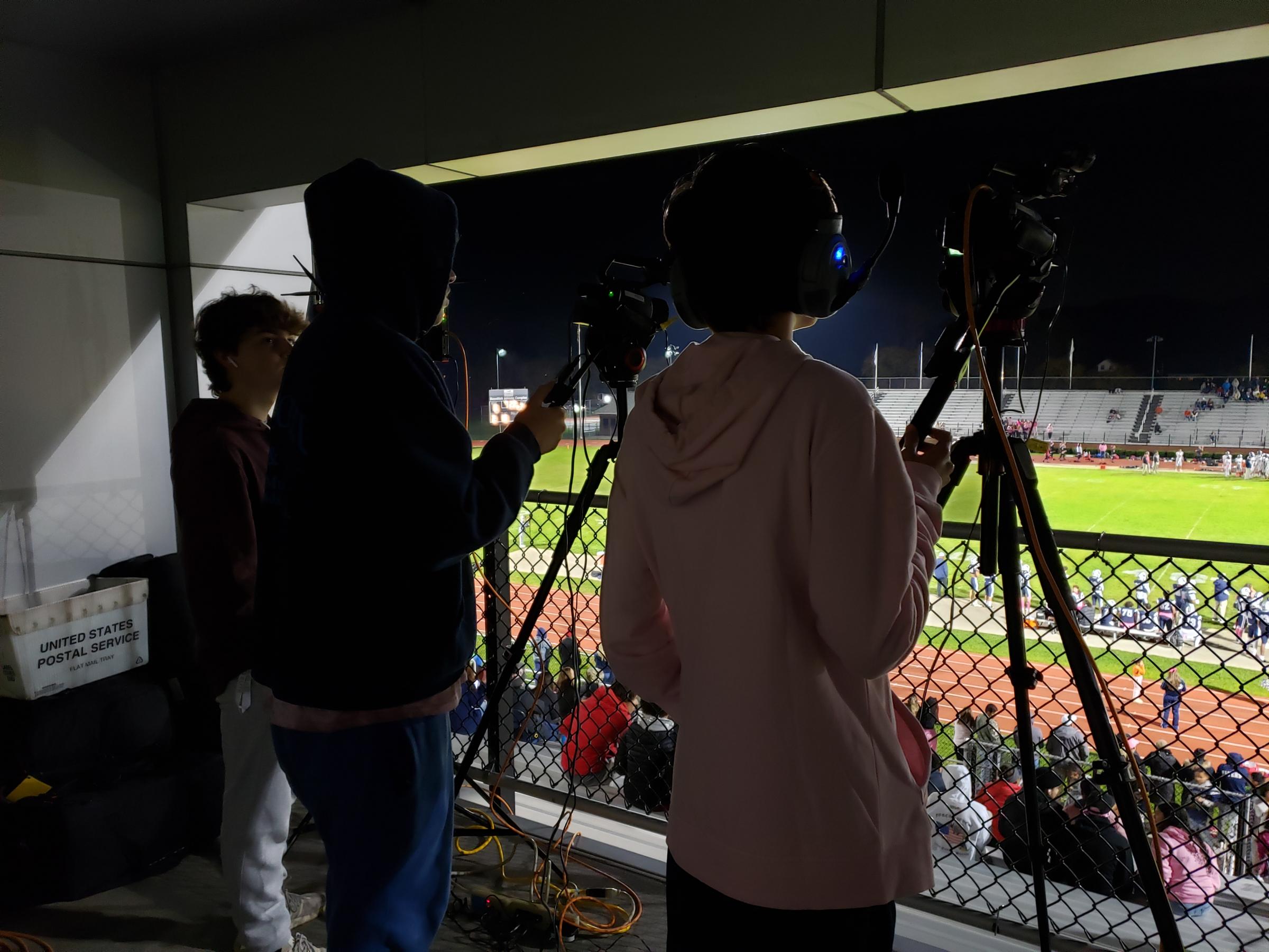 Students running camera